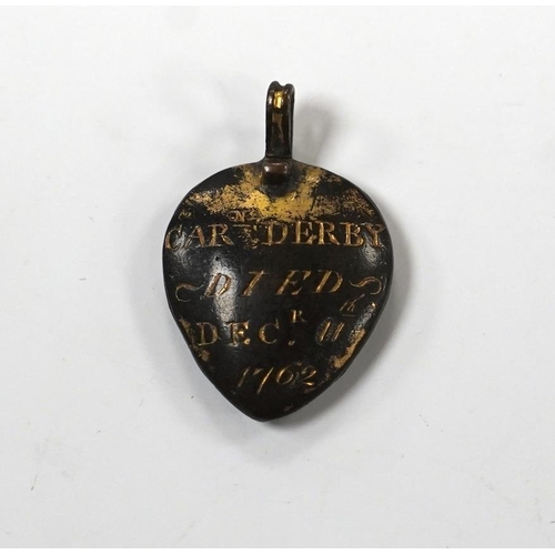 981 - An 18th century gilt metal heart shaped mourning pendant, with engraved inscription, 'CARna DERBY DI... 