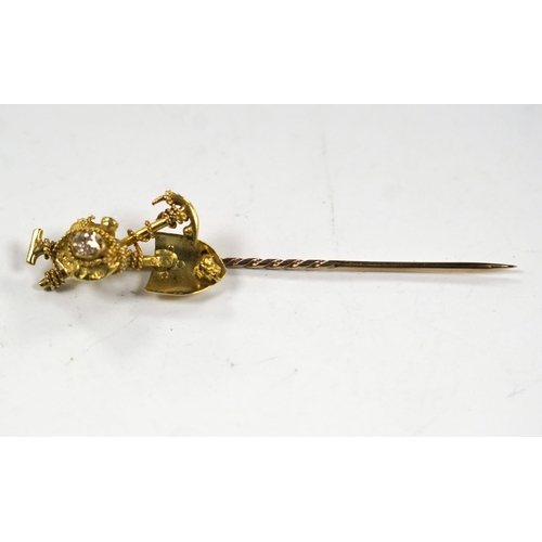 983 - An early 20th century 9ct and diamond set 'Australian miner's' stick pin, 63mm, 4 grams.