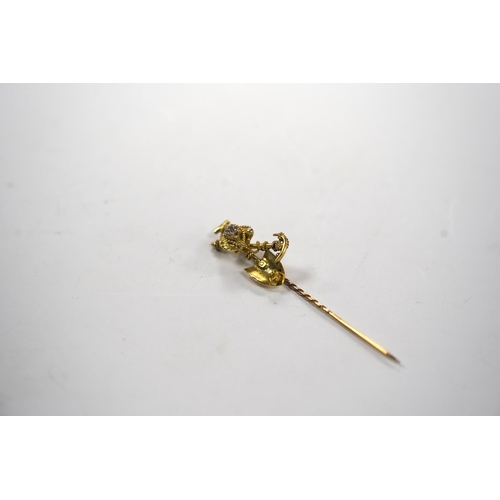 983 - An early 20th century 9ct and diamond set 'Australian miner's' stick pin, 63mm, 4 grams.