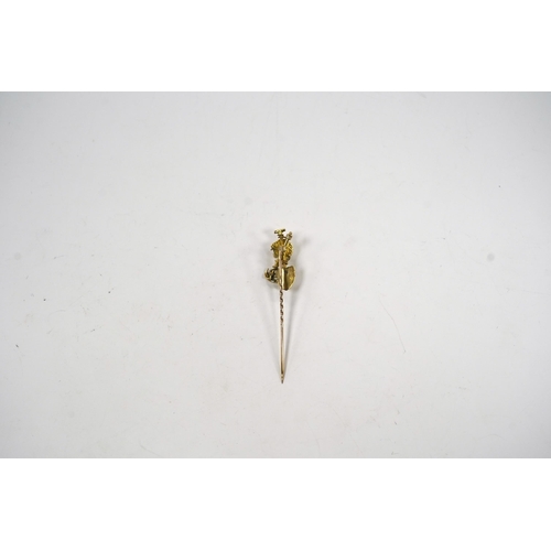 983 - An early 20th century 9ct and diamond set 'Australian miner's' stick pin, 63mm, 4 grams.