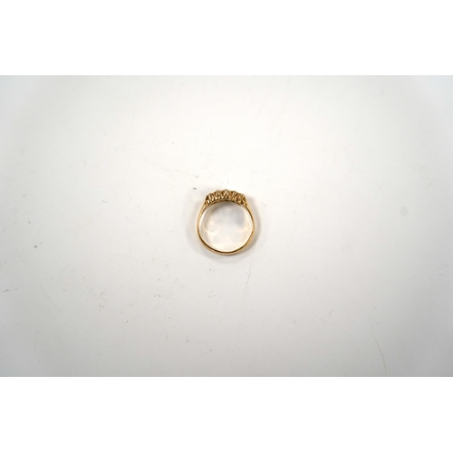 987 - An Edwardian 18ct gold and graduated five stone set diamond ring, size M, gross weight 3 grams.... 