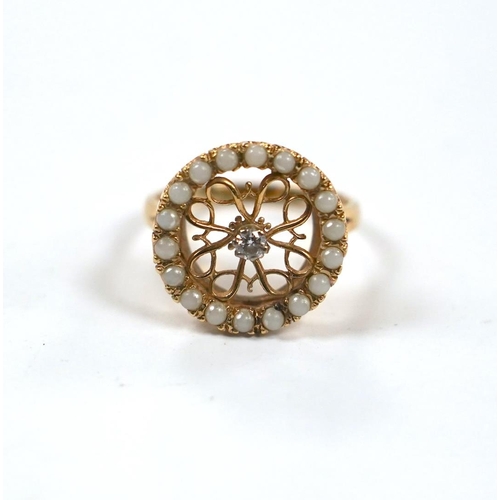 988 - A pierced 14k yellow metal, seed pearl and diamond cluster set circular ring, size P/Q, gross weight... 