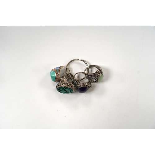 996 - Four assorted Chinese white metal filigree and gem set rings, including turquoise and amethyst.... 