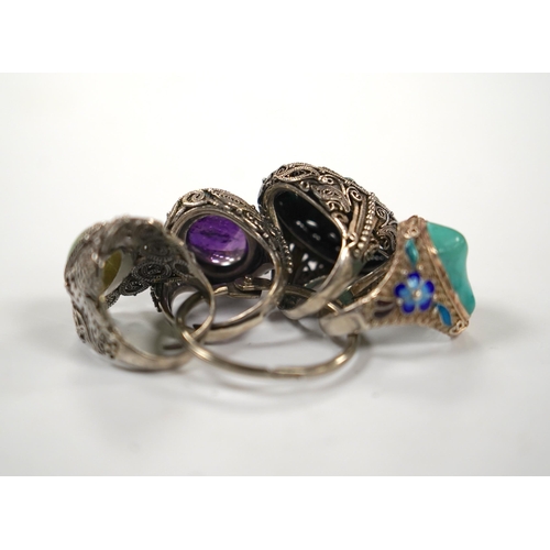 996 - Four assorted Chinese white metal filigree and gem set rings, including turquoise and amethyst.... 