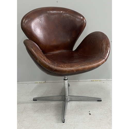 1041 - A tan leather petal chair, width 70cm, depth 42cm, height 84cm