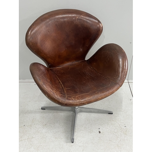 1041 - A tan leather petal chair, width 70cm, depth 42cm, height 84cm