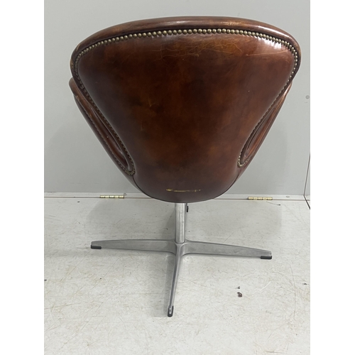 1041 - A tan leather petal chair, width 70cm, depth 42cm, height 84cm