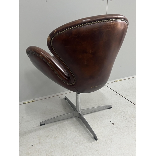 1041 - A tan leather petal chair, width 70cm, depth 42cm, height 84cm