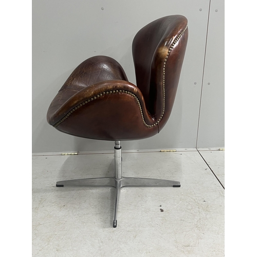 1041 - A tan leather petal chair, width 70cm, depth 42cm, height 84cm