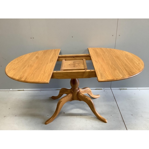 1060 - A modern Ercol elm dining table, width 110cm, depth 98cm, height 72cm (lacks spare leaf)