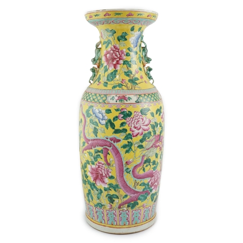 100 - A tall Chinese Straits yellow ground dragon vase, 19th century, painted with dragons amid peonies ... 