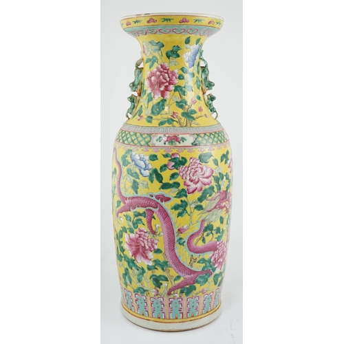 100 - A tall Chinese Straits yellow ground dragon vase, 19th century, painted with dragons amid peonies ... 