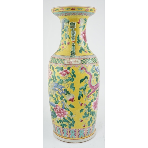 100 - A tall Chinese Straits yellow ground dragon vase, 19th century, painted with dragons amid peonies ... 