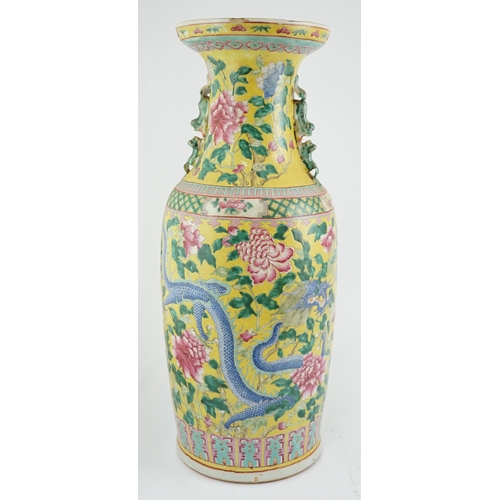 100 - A tall Chinese Straits yellow ground dragon vase, 19th century, painted with dragons amid peonies ... 