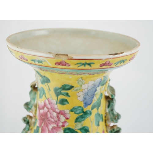 100 - A tall Chinese Straits yellow ground dragon vase, 19th century, painted with dragons amid peonies ... 