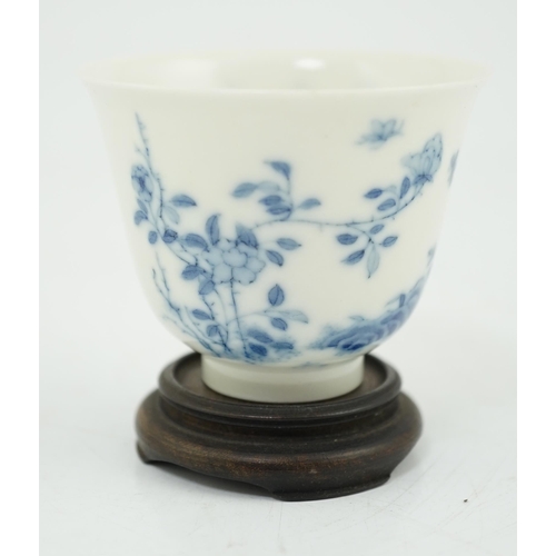101 - A Chinese blue and white 'month' cup, Kangxi mark, probably late 19th century, painted with shrubs a... 