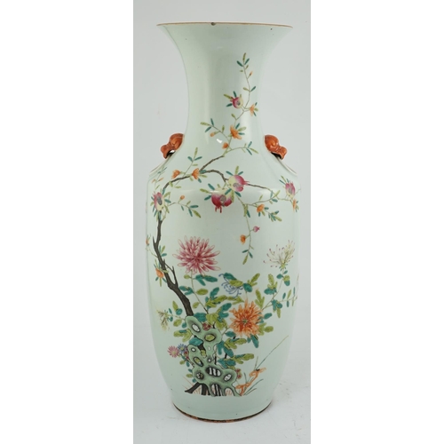 104 - A large Chinese famille rose vase, 19th century, painted with chrysanthemums, pomegranates, rockwork... 