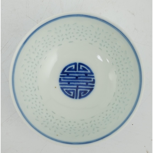 110 - A Chinese blue and white rice grain bowl, Jiaqing mark and possibly of the period, the exterior wi... 