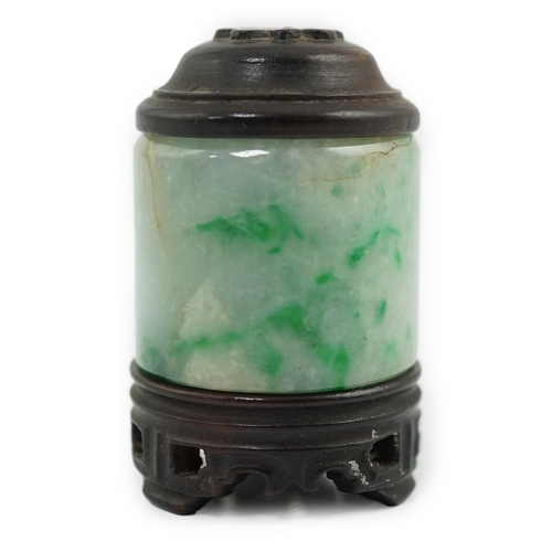 119 - A Chinese jadeite archer's thumb ring, wood stand and cover, 19th century, the ice white stone with ... 