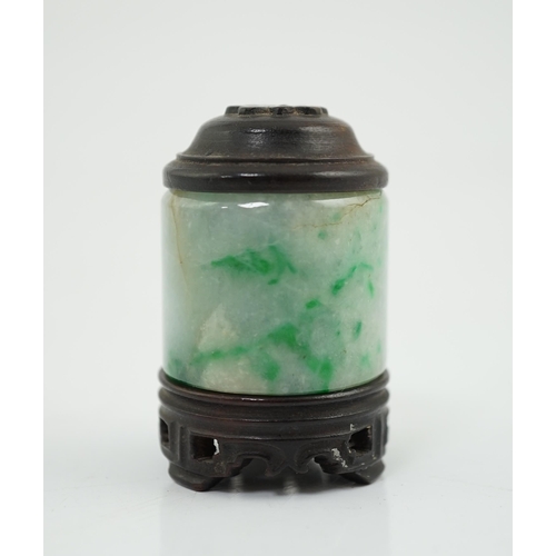 119 - A Chinese jadeite archer's thumb ring, wood stand and cover, 19th century, the ice white stone with ... 