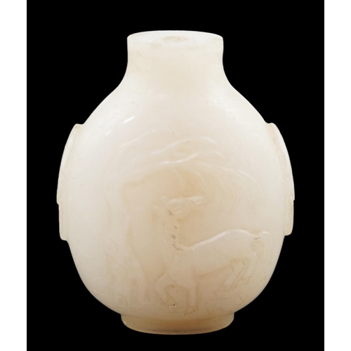 126 - A large Chinese white jade snuff bottle, 19th century, carved in relief with a horse biting leaves f... 