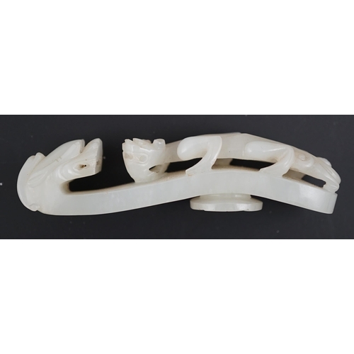 127 - A Chinese white jade dragon belt hook, 18th/19th century, carved in relief and openwork with a chi... 