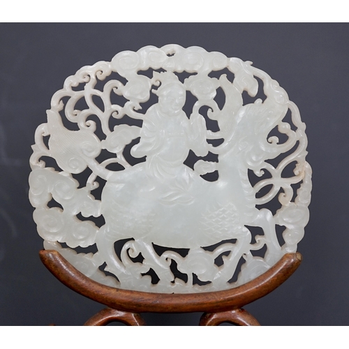 128 - A Chinese white jade qilin and rider plaque, 18th/19th century, carved and pierced to each side wi... 