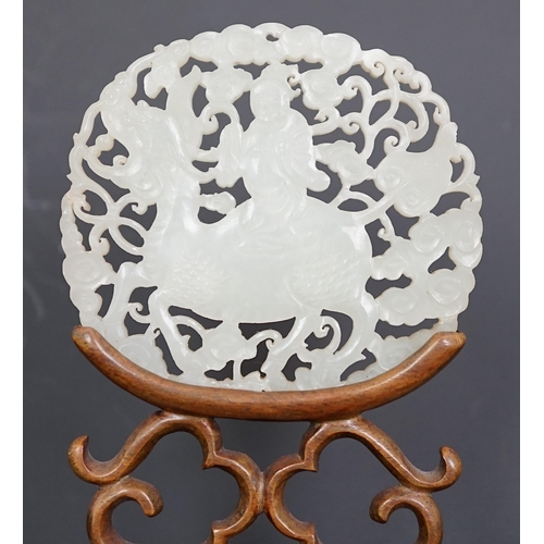 128 - A Chinese white jade qilin and rider plaque, 18th/19th century, carved and pierced to each side wi... 