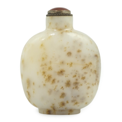 129 - A Chinese white and russet mottled jade snuff bottle, 18th/19th century, on an oval foot, 6.2cm high... 