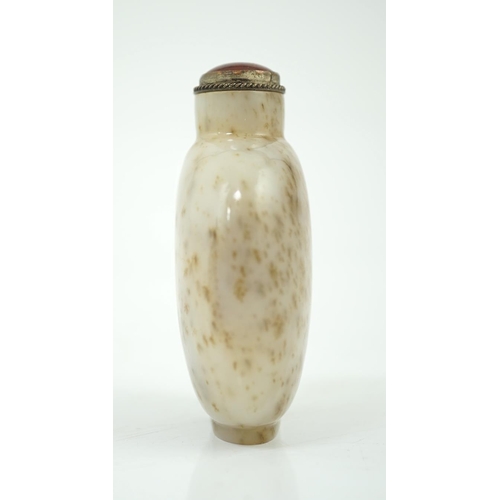 129 - A Chinese white and russet mottled jade snuff bottle, 18th/19th century, on an oval foot, 6.2cm high... 