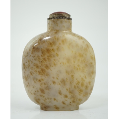 129 - A Chinese white and russet mottled jade snuff bottle, 18th/19th century, on an oval foot, 6.2cm high... 