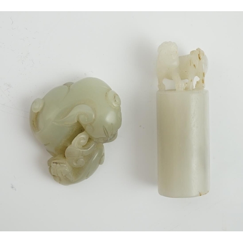 131 - A Chinese white jade lion-dog seal and a Chinese pale celadon  jade group of a lion dog and cub, 19t... 