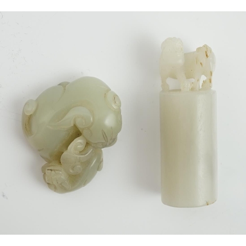 131 - A Chinese white jade lion-dog seal and a Chinese pale celadon  jade group of a lion dog and cub, 19t... 