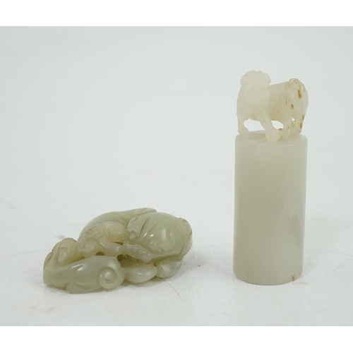 131 - A Chinese white jade lion-dog seal and a Chinese pale celadon  jade group of a lion dog and cub, 19t... 