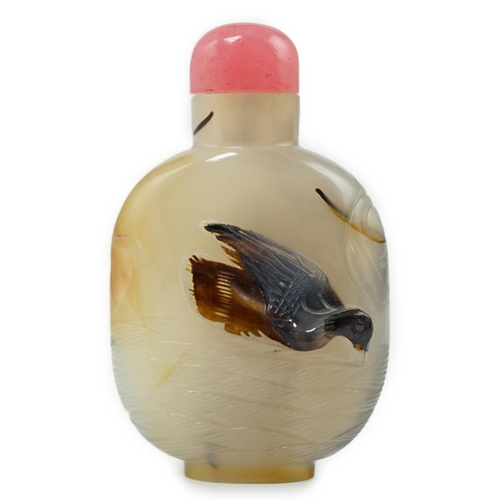 136 - A Chinese shadow/cameo agate 'duck in a pond' snuff bottle, 19th/20th century, carved in relief to a... 