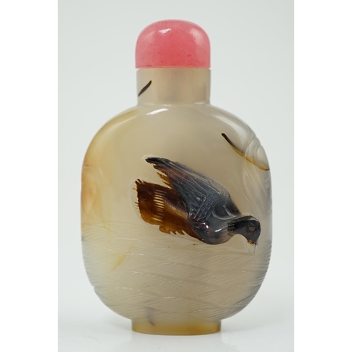 136 - A Chinese shadow/cameo agate 'duck in a pond' snuff bottle, 19th/20th century, carved in relief to a... 