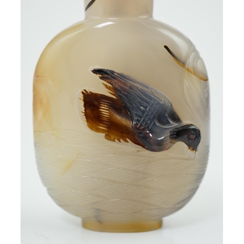 136 - A Chinese shadow/cameo agate 'duck in a pond' snuff bottle, 19th/20th century, carved in relief to a... 