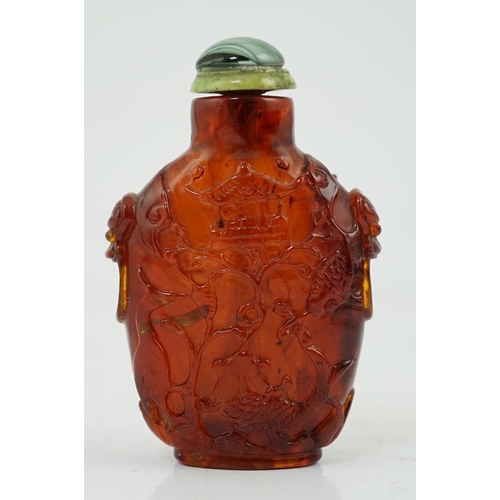 140 - A Chinese carved amber snuff bottle, 19th century, carved in relief with a horse, bird, yin-yang sym... 