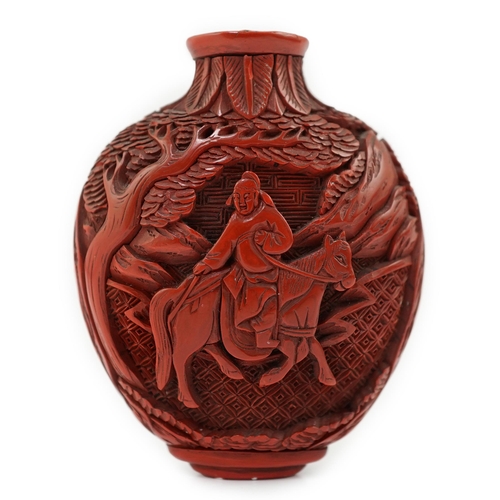 141 - A Chinese cinnabar lacquer snuff bottle, 19th century, of flattened ovoid form, carved in high relie... 