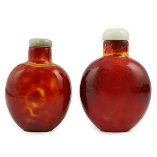 142 - Two Chinese glass snuff bottles imitating realgar, 18th/19th century, each of flattened ovoid form, ... 