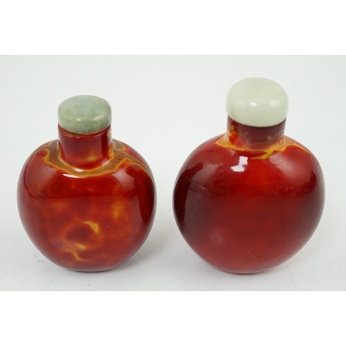 142 - Two Chinese glass snuff bottles imitating realgar, 18th/19th century, each of flattened ovoid form, ... 