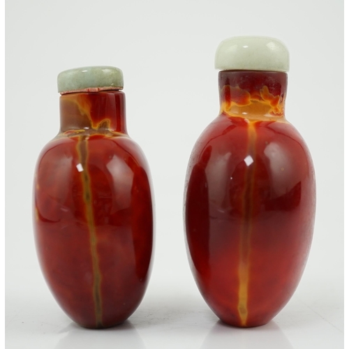 142 - Two Chinese glass snuff bottles imitating realgar, 18th/19th century, each of flattened ovoid form, ... 