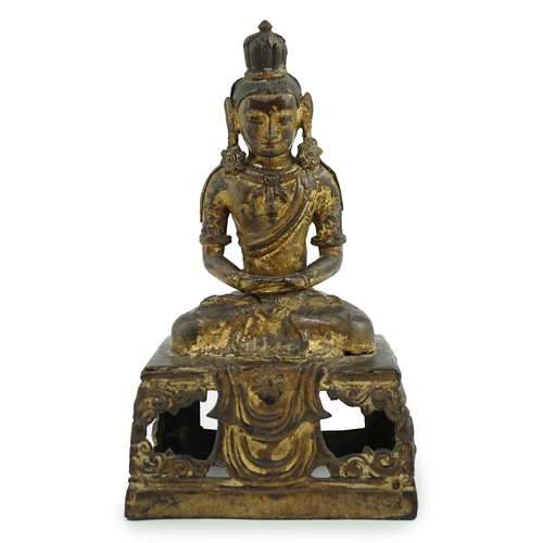 149 - A Sino-Tibetan gilt repoussé copper alloy seated figure of Amitayus, Qianlong period, on an openwork... 