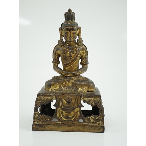 149 - A Sino-Tibetan gilt repoussé copper alloy seated figure of Amitayus, Qianlong period, on an openwork... 