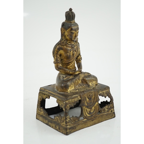 149 - A Sino-Tibetan gilt repoussé copper alloy seated figure of Amitayus, Qianlong period, on an openwork... 