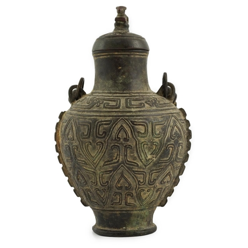 150 - A Chinese archaistic bronze hanging vessel, hu, 17th/18th century, cast in relief with scrolls and l... 