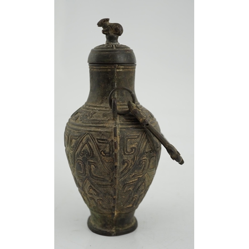 150 - A Chinese archaistic bronze hanging vessel, hu, 17th/18th century, cast in relief with scrolls and l... 