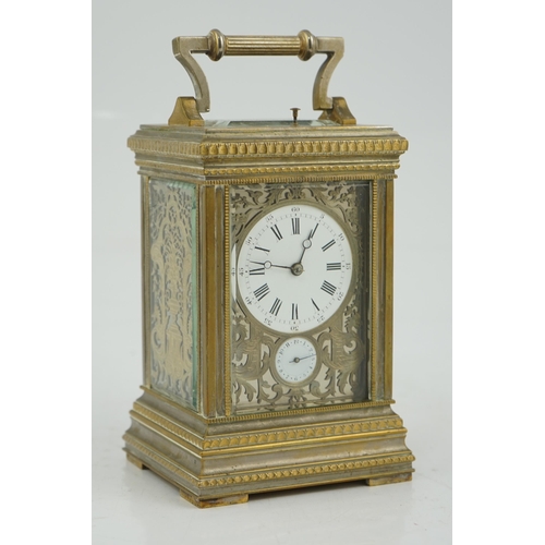 163 - An early 20th century French silvered brass grand sonnerie alarum carriage clock with fretwork panel... 