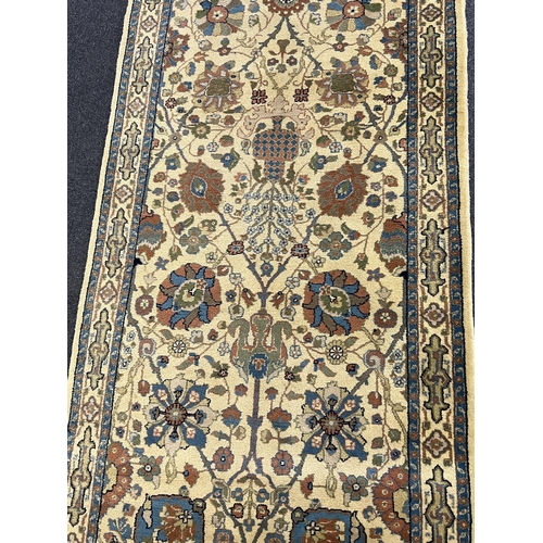 189 - A Lahore runner, with field of foliate motifs on a gold ground, 395 x 90cm