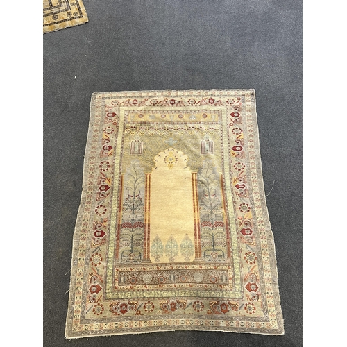 192 - A Turkish silk prayer rug, with central mihrab and stylised floral borders, 205 x 122cm